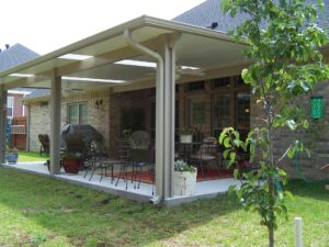 Beautiful patio cover with sunlights over a spacious outdoor living space in a Southern Ohio home